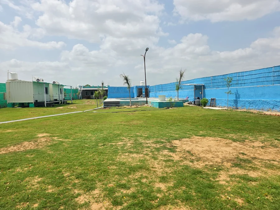 Open lawn and property view at Clyrova Farmhouse Mahlan Jaipur