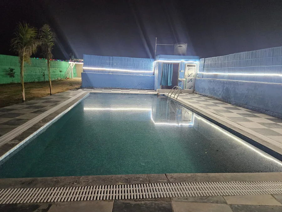 Private swimming pool at Clyrova Farmhouse at night